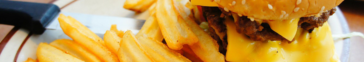 Eating American (Traditional) Burger Diner at Manny's Texas Wieners restaurant in Vauxhall, NJ.